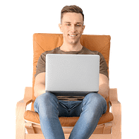 Man-sitting-in-armchair-with-laptop