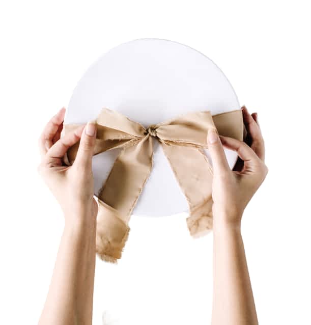 white-circular-box-with-golden-ribbon